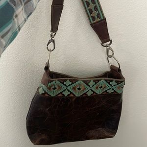 Hand made leather western style purse.